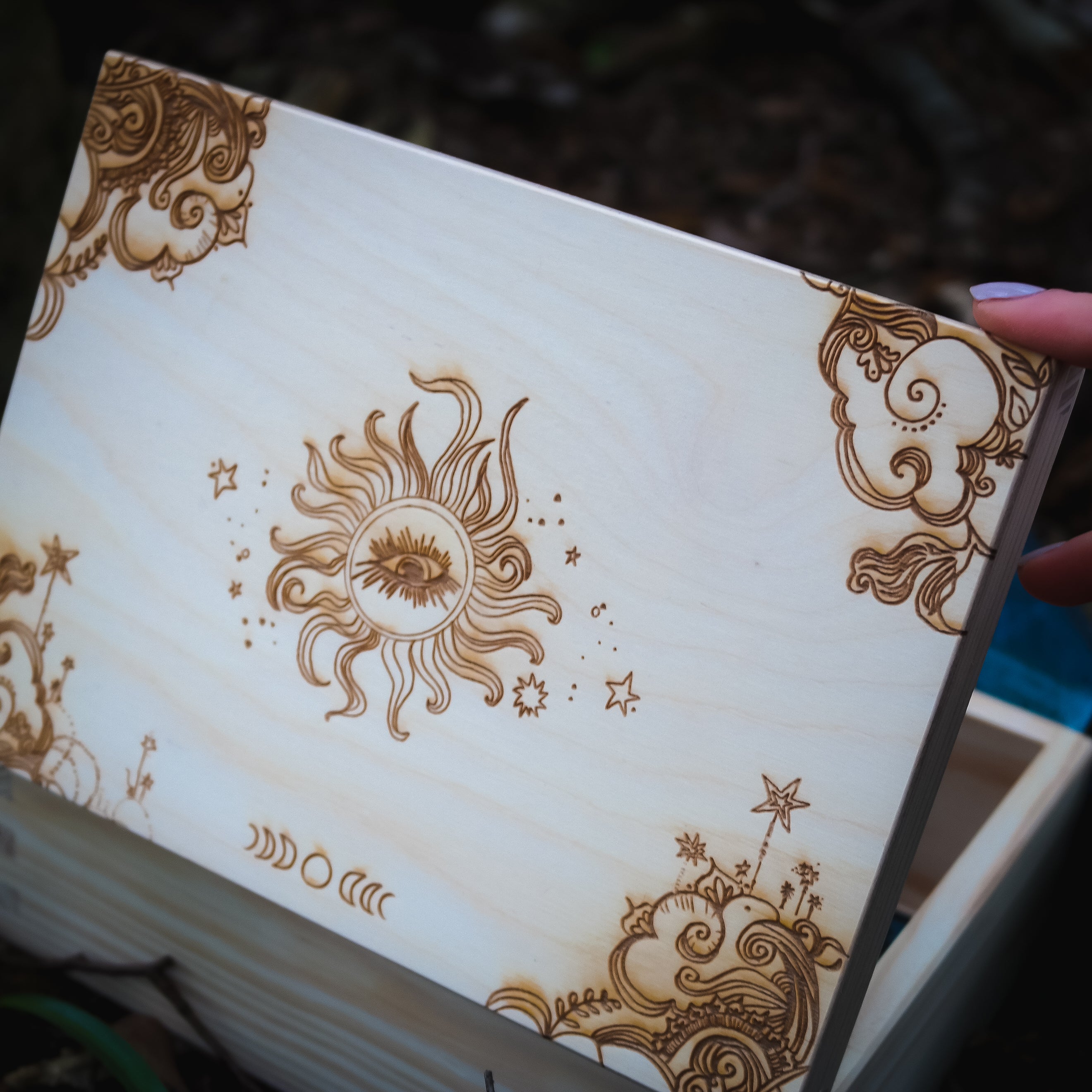 Handmade wooden trinket box etched with all seeing eye, moon phase, celestial design.