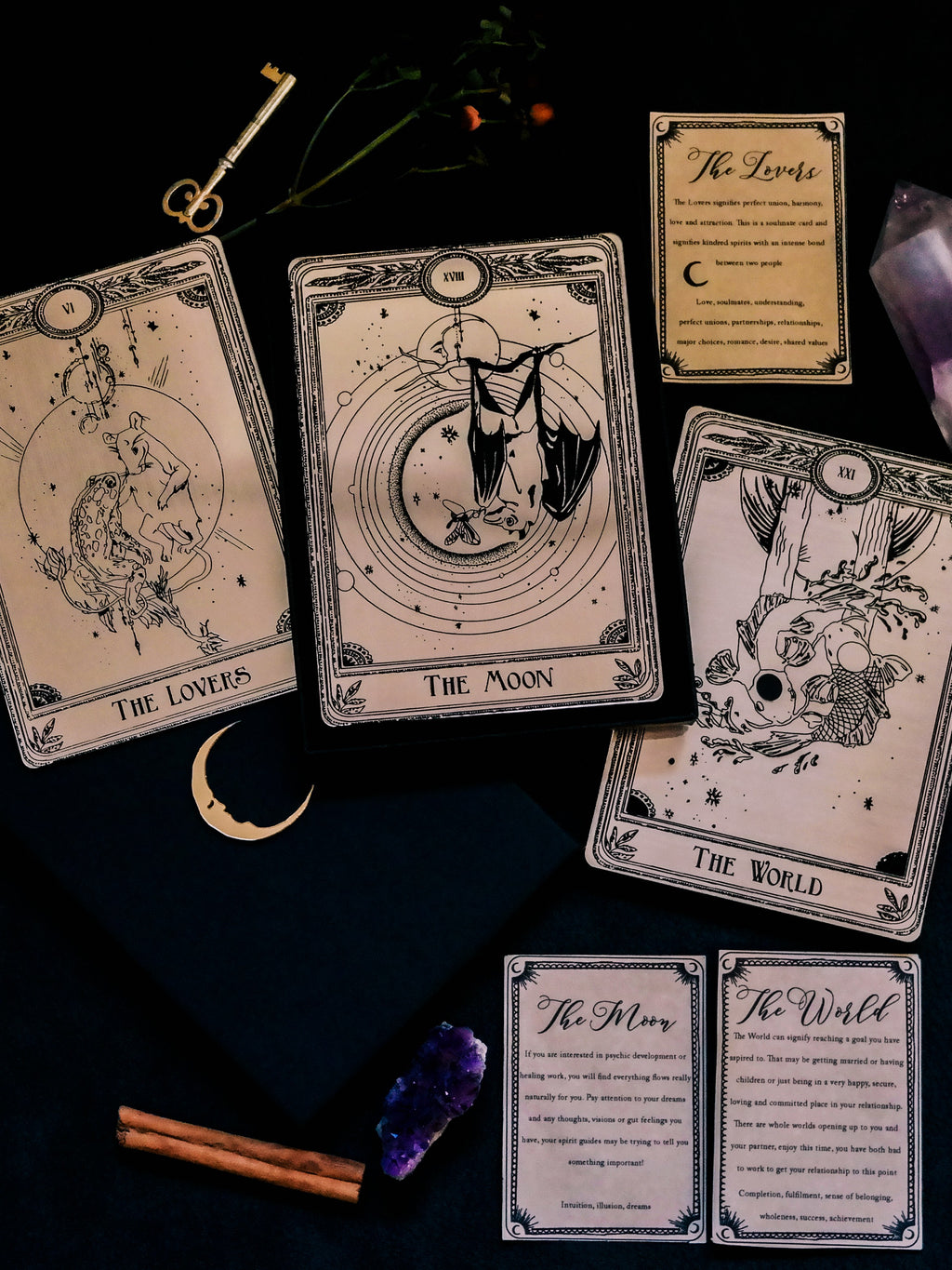 three decorative gold tarot cards 