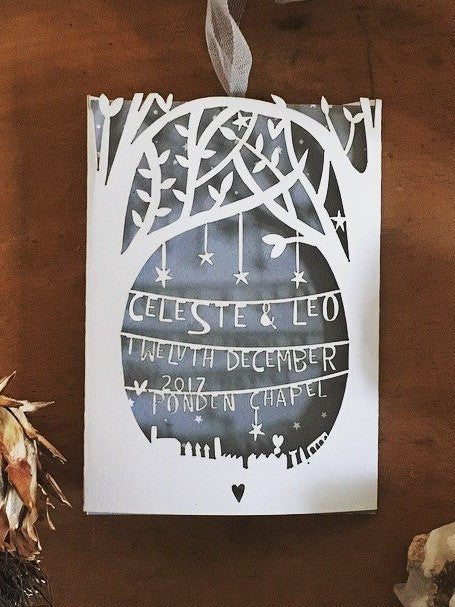 A laser cut wedding invitation.