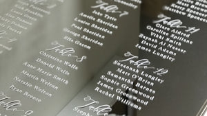 A silver mirror themed wedding seating plan