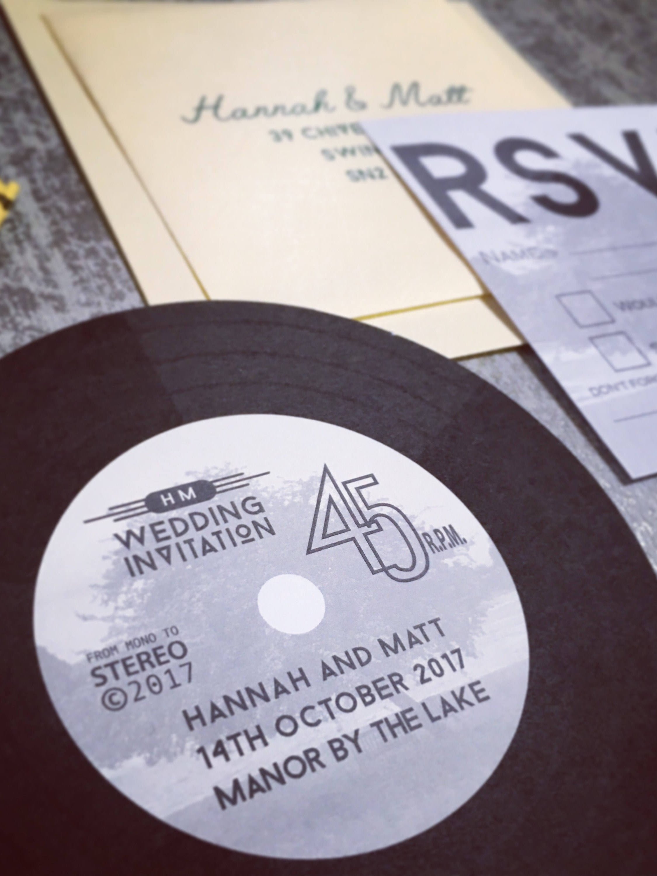 A wedding invitation shaped like a record.