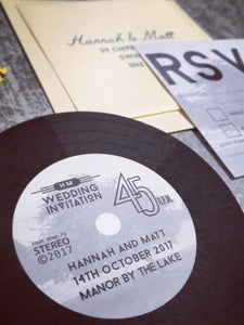 A wedding invitation shaped like a record.