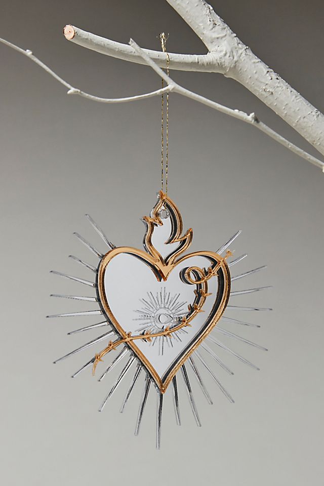 Sacred heart ornament hanging in tree