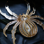 Load image into Gallery viewer, A spider shaped mirror in gold and silver
