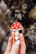 Load image into Gallery viewer, A red, white and silver toadstool shaped necklace with acrylic and mirror held in hands
