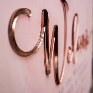 Pink Acrylic Sign with Gold Welcome close up of acrylic 