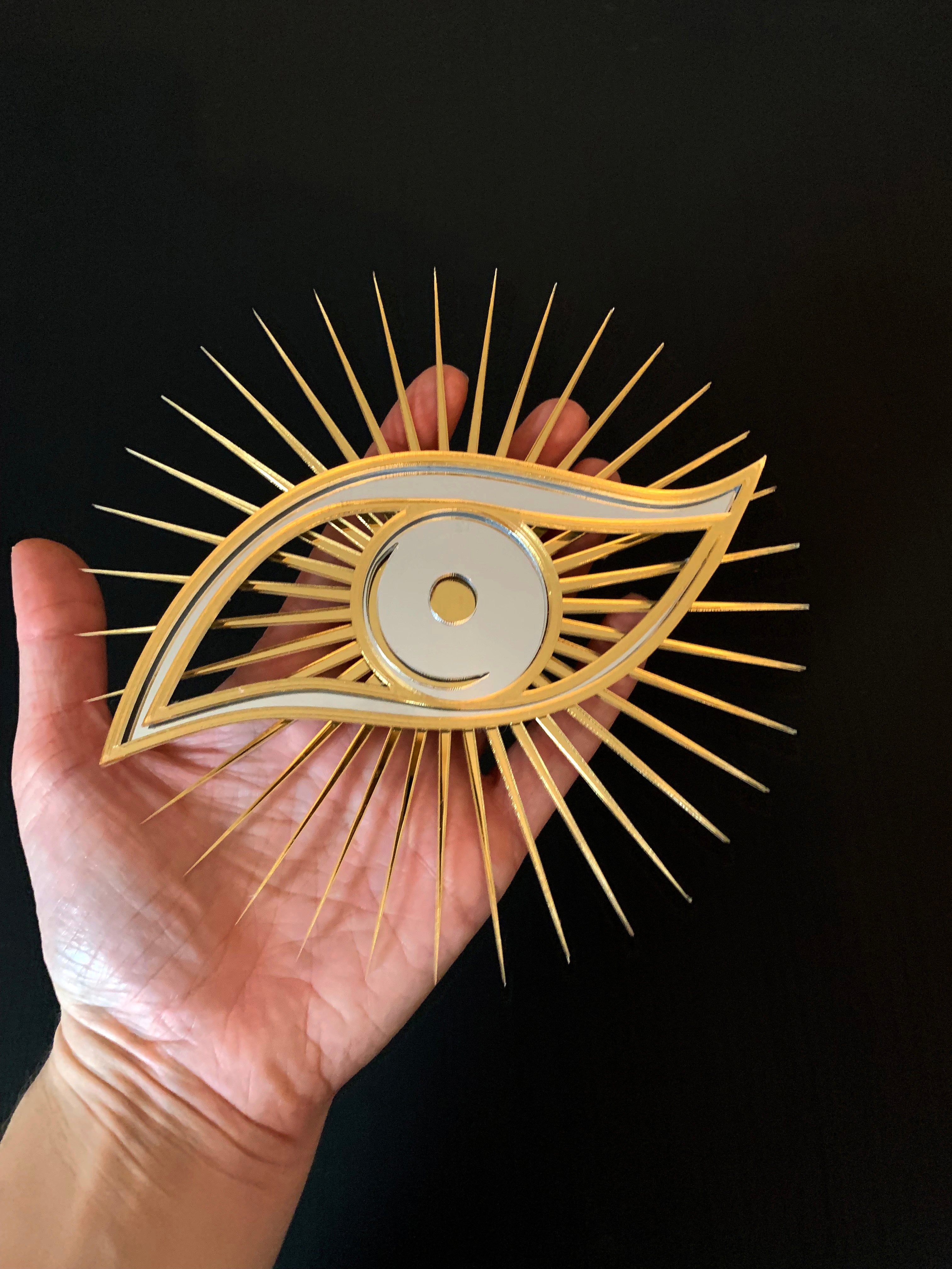 All seeing eye shaped christmas tree topper.