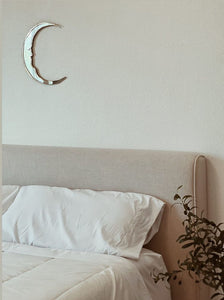 handmade crescent moon shaped mirror in home