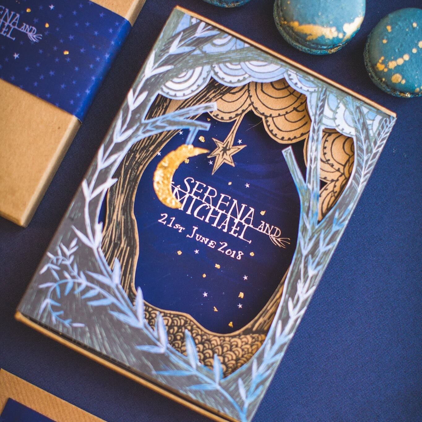 Laser cut boxed wedding invitation with woodland scene and gold leaf moon