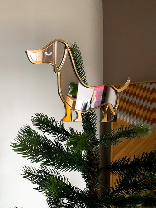 sausage dog shaped mirror on the top of a christmas tree
