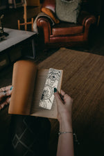 Load image into Gallery viewer, Mystical Eye and Lion Bookmark inside book as pages turn
