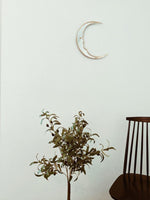 Load image into Gallery viewer, crescent moon shaped mirror next to olive tree
