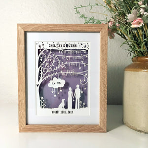 An anniversary themed paper cut with purple and white colour scheme
