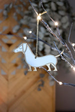 Load image into Gallery viewer, Gold and silver mirrored sausage dog ornament.
