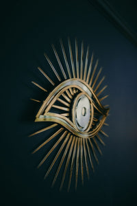 All seeing eye shaped mirror.