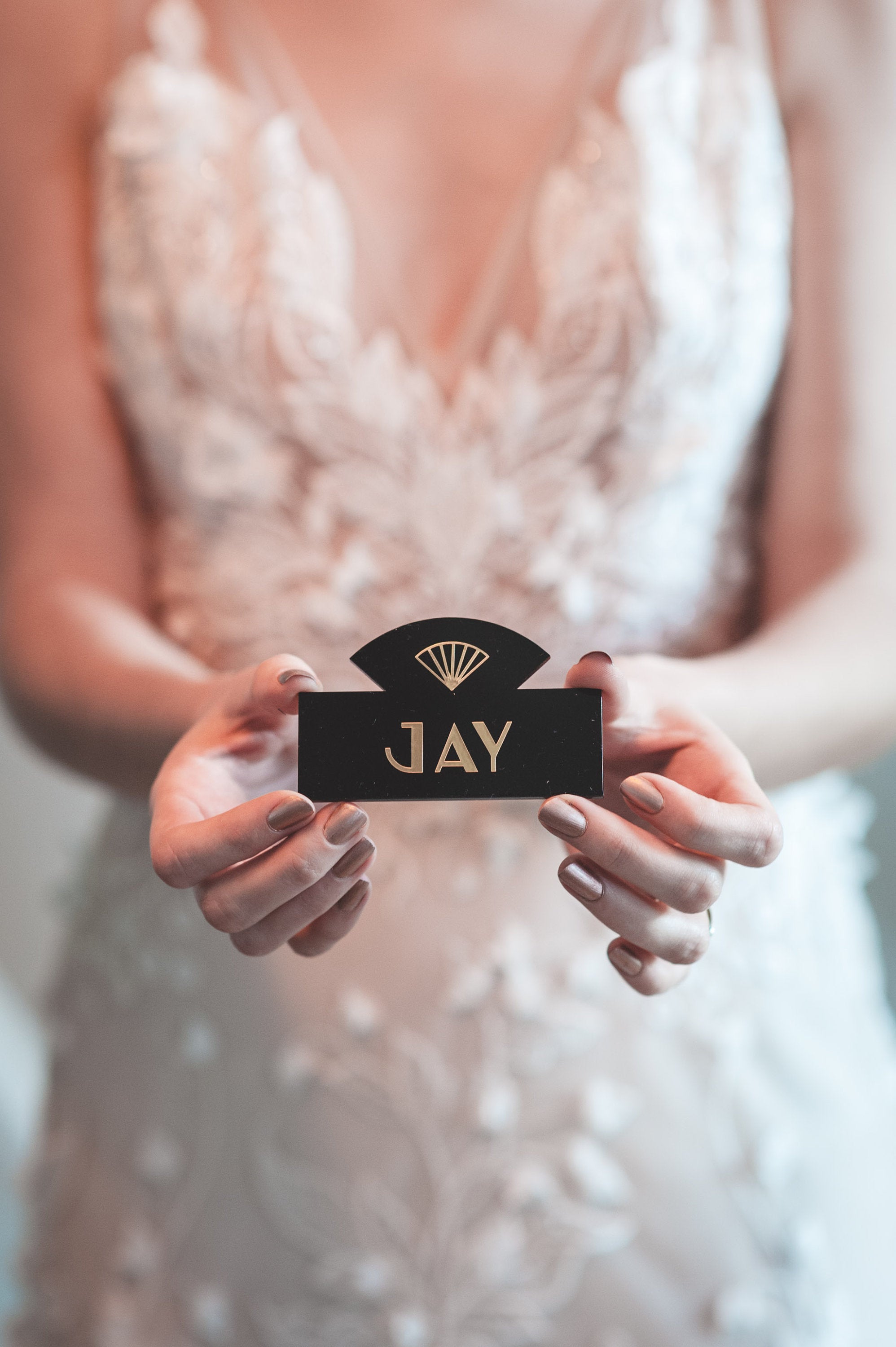 Art Deco Wedding place name held by bride