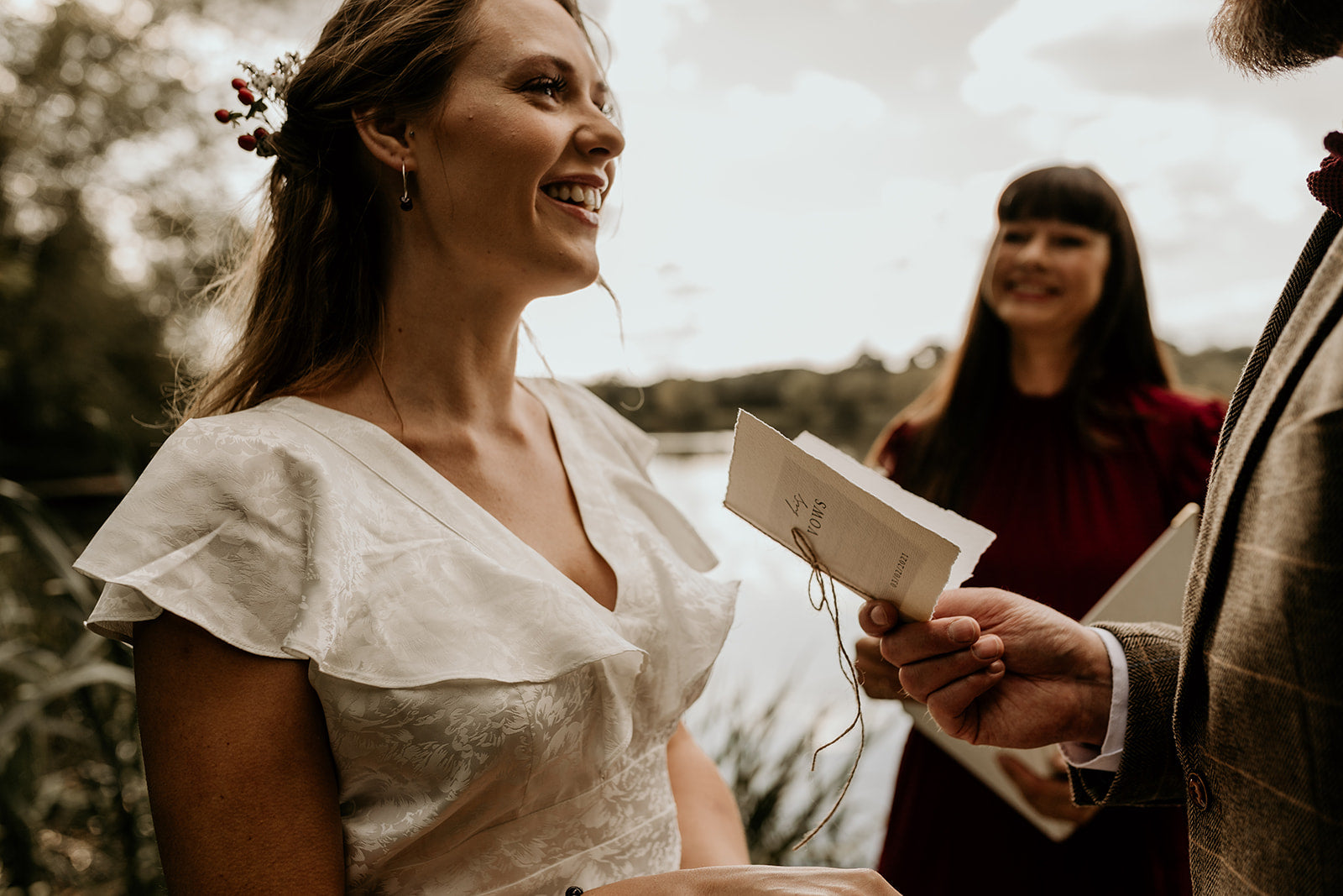 His vow book being read to bride