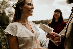 His vow book being read to bride