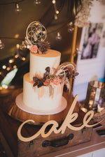 Load image into Gallery viewer, Sacred Geometry wooden cake topper on stand with wooden sign saying cake.
