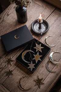 Star and crescent moon shaped christmas baubles.