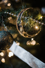 Load image into Gallery viewer, crescent moon shaped bauble hanging from tree
