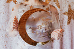 Load image into Gallery viewer, a clear acrylic wedding sign with gold names and gold crescent moon held in hands.
