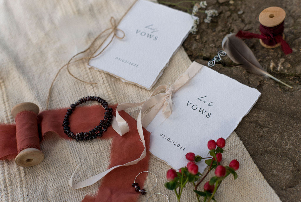 His and hers vow books on the beach