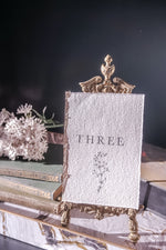 Load image into Gallery viewer,  handmade rag paper table number with floral design
