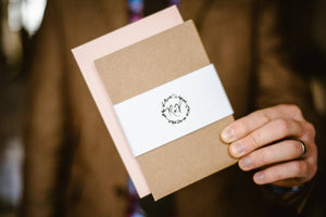 A rustic brown envelope for invitation with floral design