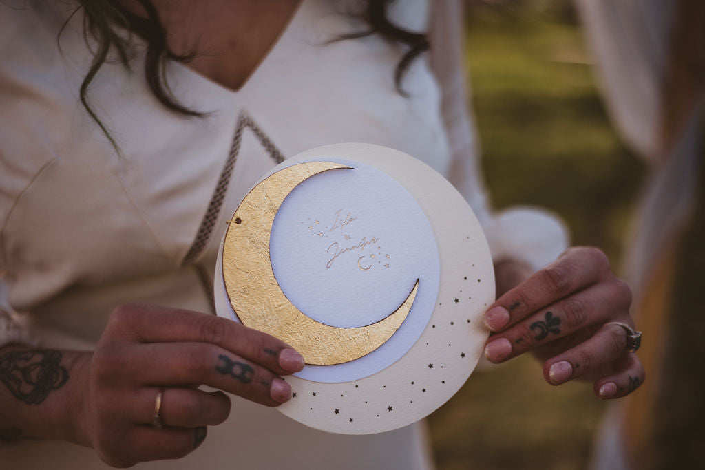 A crescent moon themed wedding invitation 