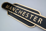Load image into Gallery viewer, Black &amp; Gold Manchester railway sign for home decoration.
