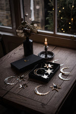 Load image into Gallery viewer, Star and crescent moon shaped christmas baubles in gift box on table.
