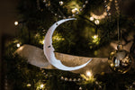 Load image into Gallery viewer, crescent moon shaped christmas ornament hanging from tree
