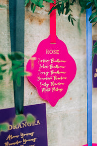 pink acrylic hanging seating plan display for a wedding