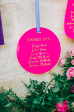Load image into Gallery viewer, Pink acrylic hanging seating plan display for a wedding
