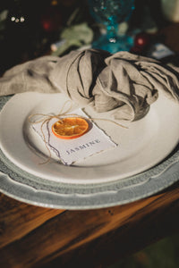 Mediterranean place names on plate with dried orange slice