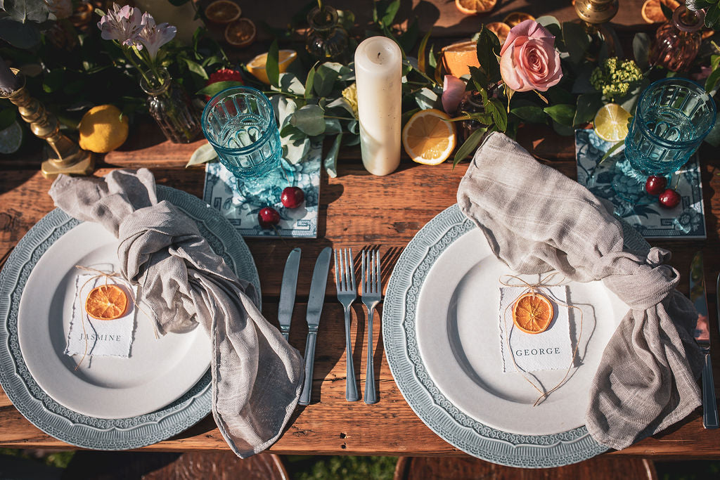 Mediterranean style wedding place names with orange slice