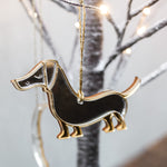 Load image into Gallery viewer, Gold and silver mirrored sausage dog ornament hanging.
