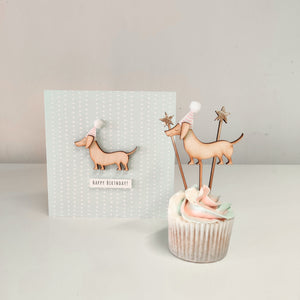 A wooden sausage dog cupcake topper and birthday card with wooden decal