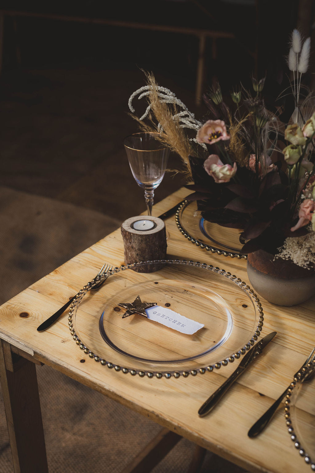 A place name at a wedding table with a gold star