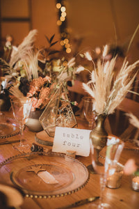 Table four table number with star place name and floral set up