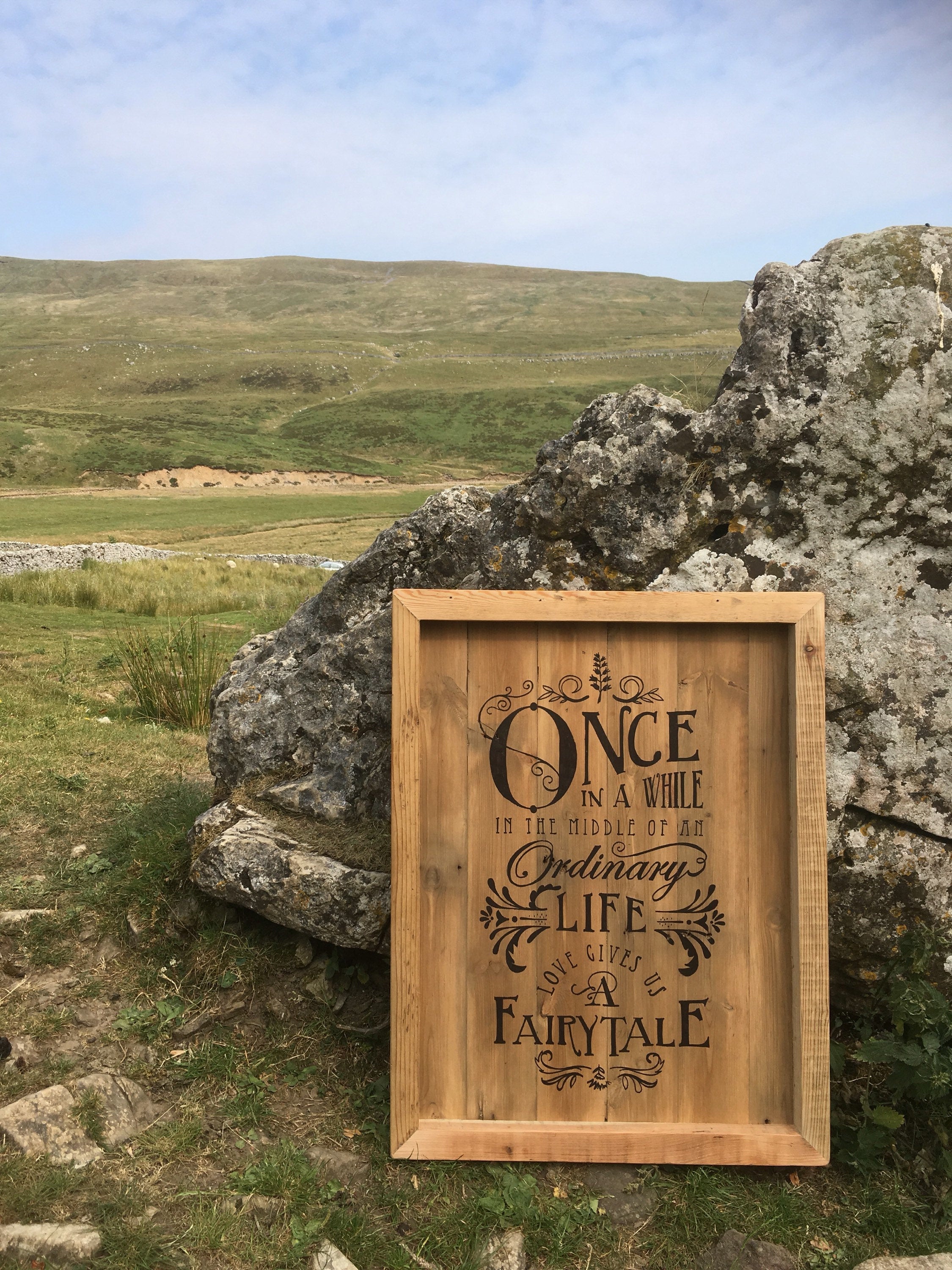 Fairytale Wooden Wedding Sign in outdoors